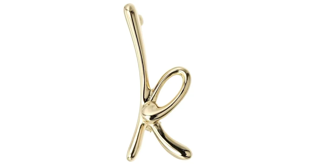 Broche de oro amarillo de 18K con la inicial K de Tiffany & Co. 